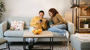 Women Relaxing on a Cozy Sofa